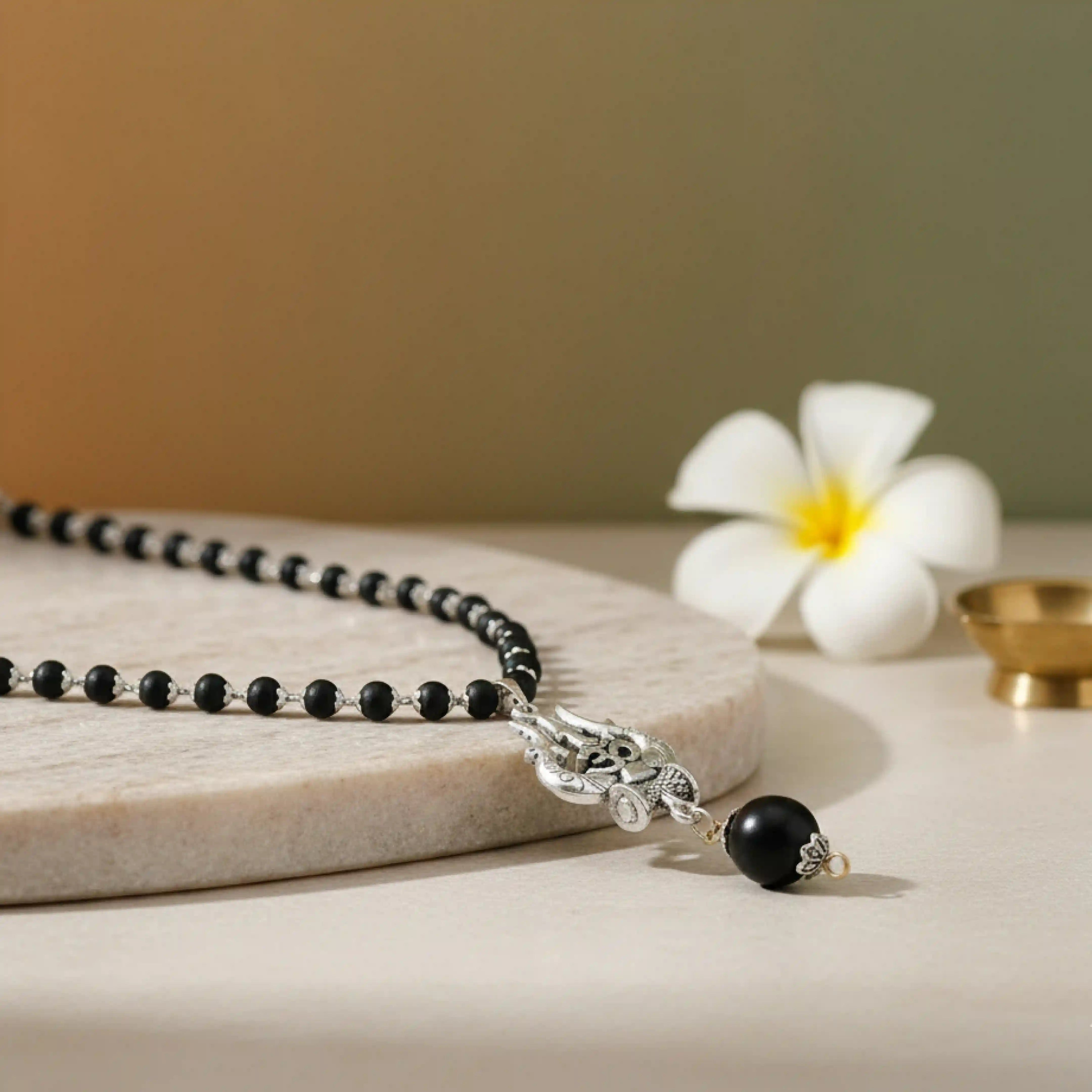 Silver Capped Karungali Malai - Om Trishul Pendant