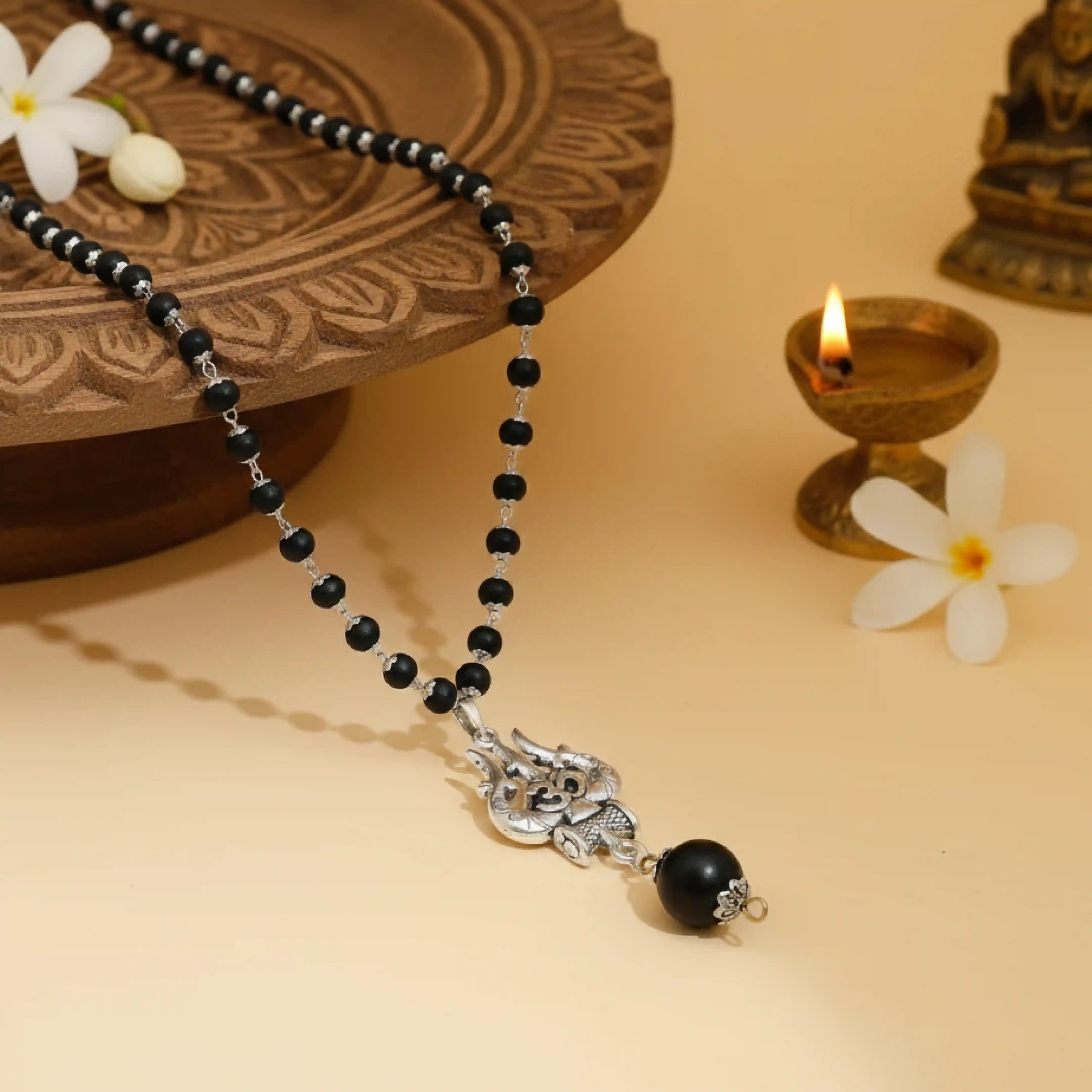 Silver Capped Karungali Malai - Om Trishul Pendant